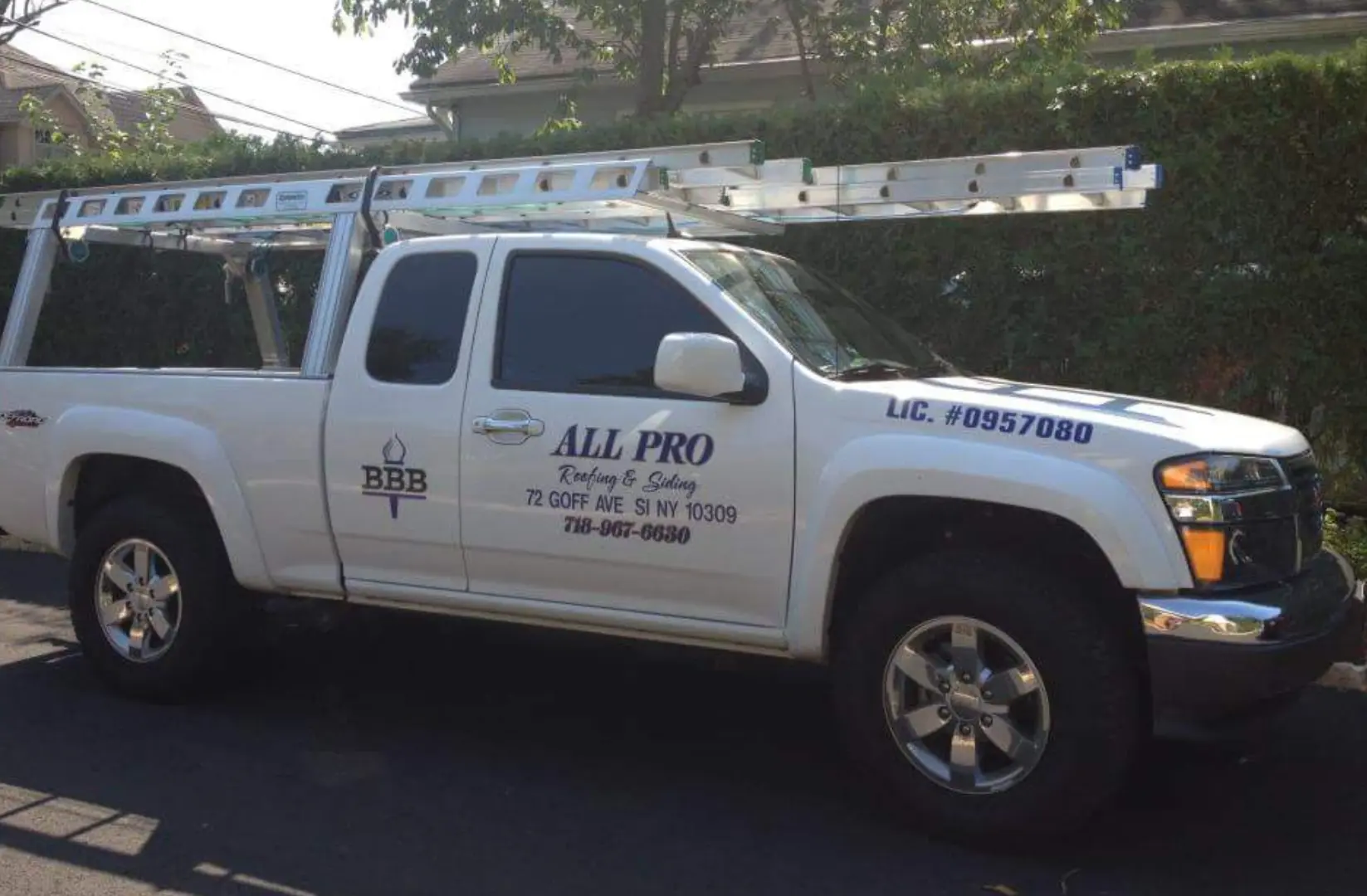 A white truck with the words " all pro " on it.